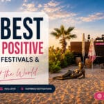 Cap d'Agde beach at sunrise with beach bar and bronze statue featured in a guide to the best body positive places, festivals and events around the world.